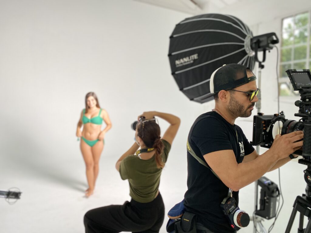 woman in green bikini has her photo taken on a mallorca studio shoot 
